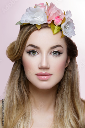 Beautiful girl with flowers in hair