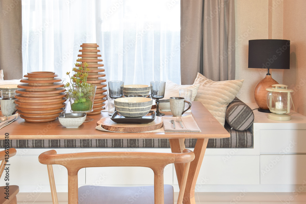 dining wooden table and comfortable chairs in modern home with elegant table setting dining wooden table and comfortable chairs in modern home with elegant table setting