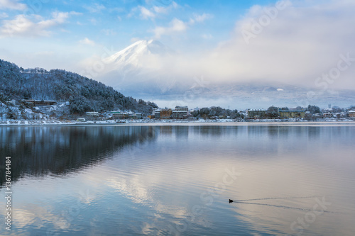 Mountain Fuji and Kawaguchiko lake with morning mist in winter season