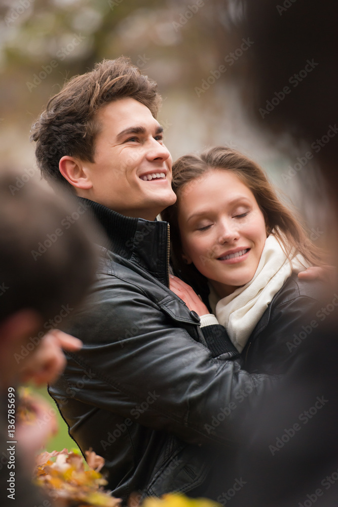 Autumn portrait of attractive happy couple Autumn portrait of attractive happy couple