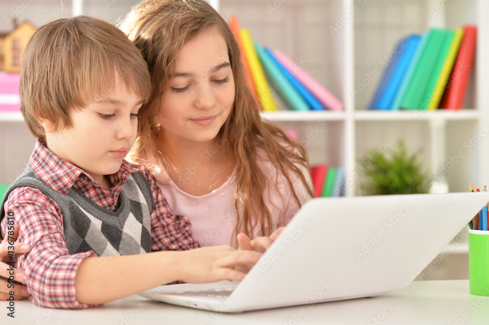 Boy and girl using laptop Boy and girl using laptop