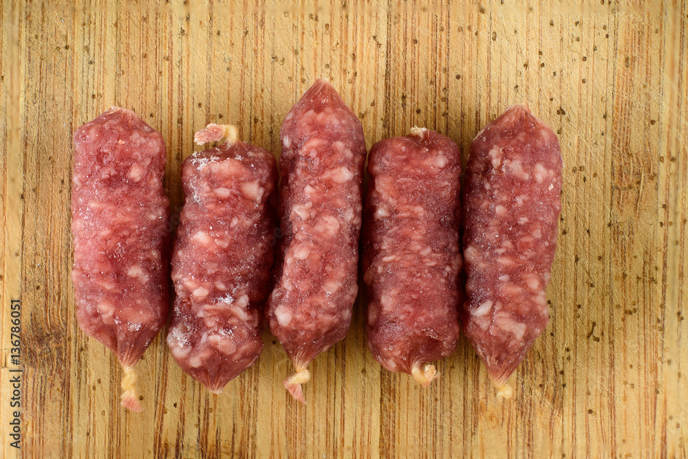 sausages on wooden table sausages on wooden table
