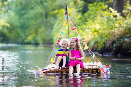 Kids on wooden raft