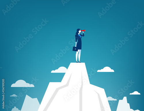 Businesswoman standing on top of the mountain using telescope lo