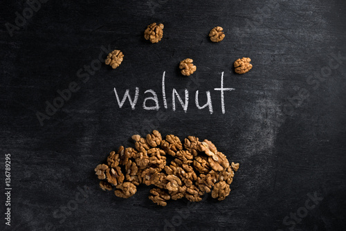 Walnut over dark chalkboard background