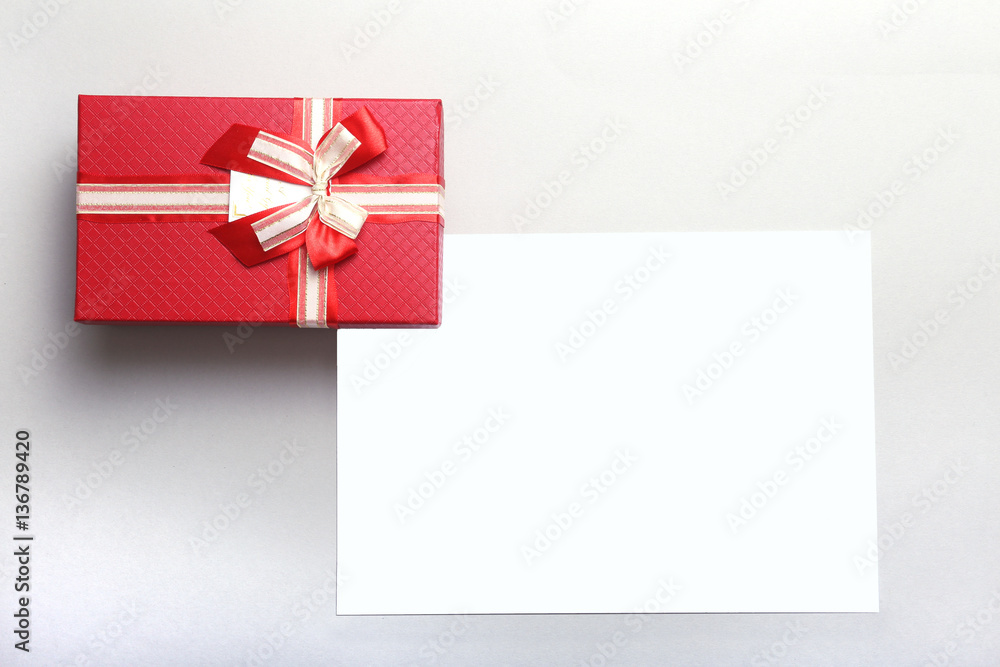 Beautiful gold, red present gift box and ribbons on backgound Beautiful gold, red present gift box and ribbons on backgound