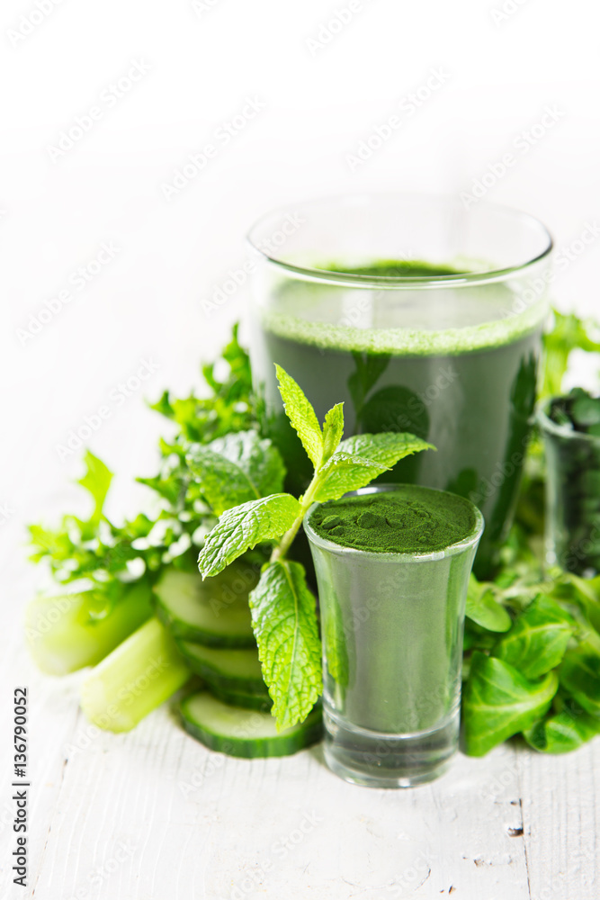 Healthy green smoothie in a glass with vegetables. Healthy green smoothie in a glass with vegetables.