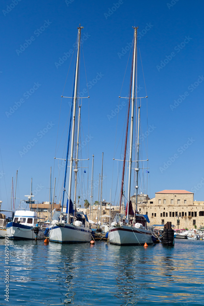 Sailing yachts are moored in marina in Acre, Israel