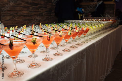 Many tasty colorful cocktails at a party, refreshments