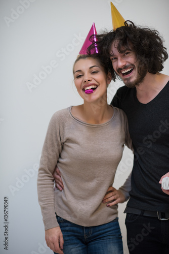 Wallpaper Mural couple in party hats blowing in whistle Torontodigital.ca