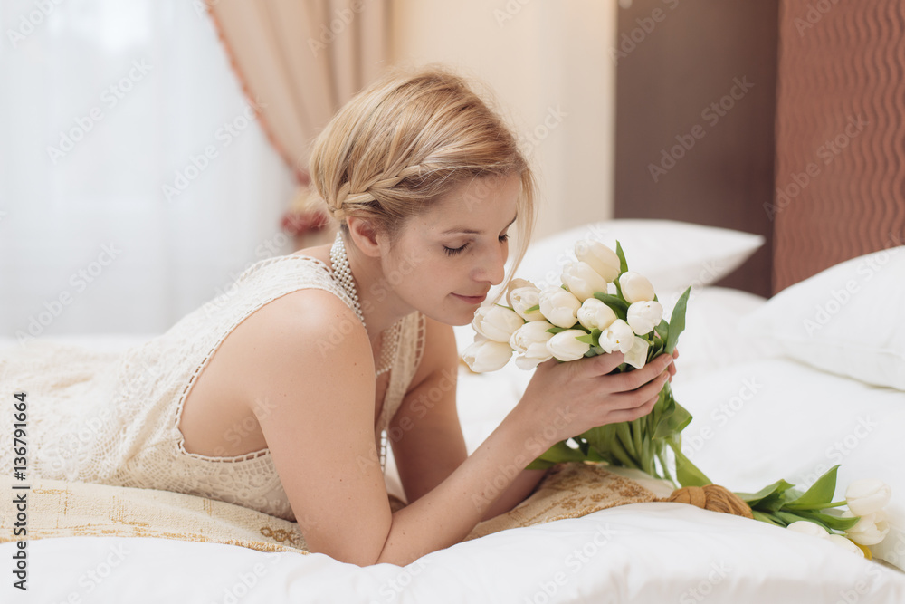 Beautiful bride and flower bouquet in hotel room. Bridal concept. Beautiful bride and flower bouquet in hotel room. Bridal concept.