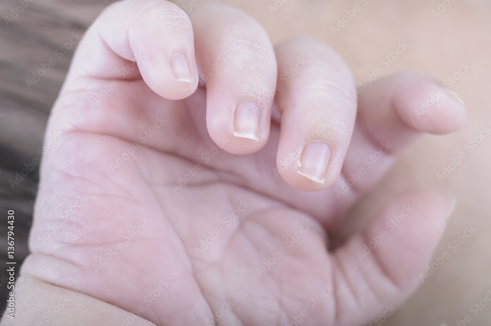 Innocence, Hand of newborn. Hands of father and son united. Mate Innocence, Hand of newborn. Hands of father and son united. Mate