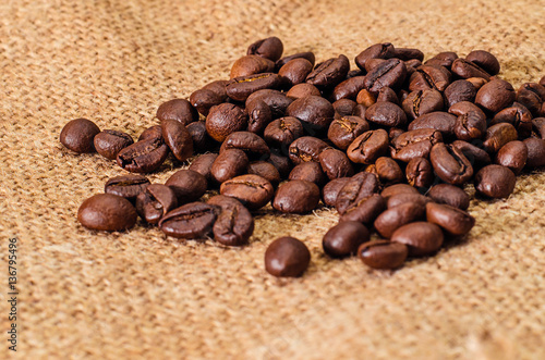 coffee beans on burlap background photo