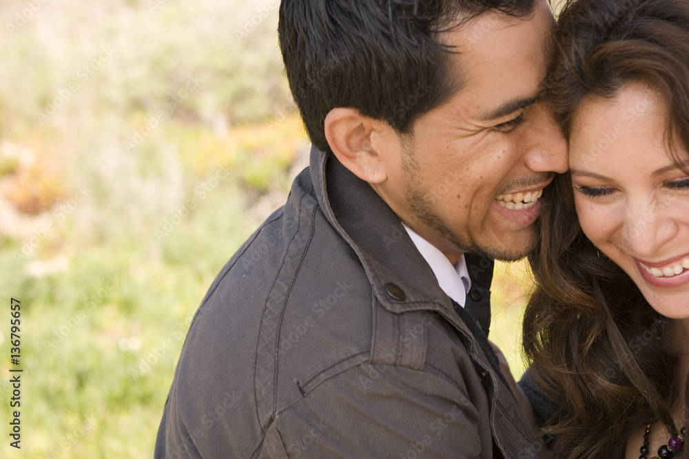 Fototapeta premium Beautiful Hispanic couple laughing and smiling.