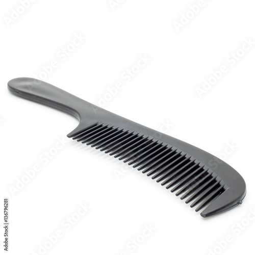 Black hairbrush on a white background.Isolated