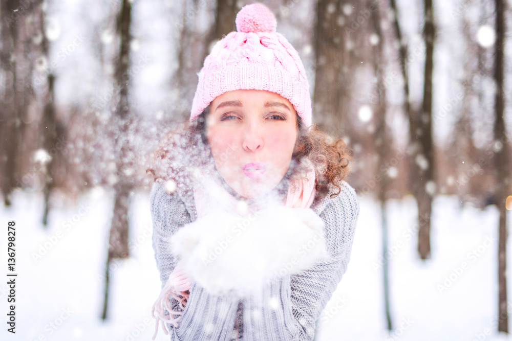 Winter young woman portrait. Beauty Joyful Model Girl having fun in winter park. Beautiful young woman laughing outdoors. Enjoying nature, wintertime Winter young woman portrait. Beauty Joyful Model Girl having fun in winter park. Beautiful young woman laughing outdoors. Enjoying nature, wintertime