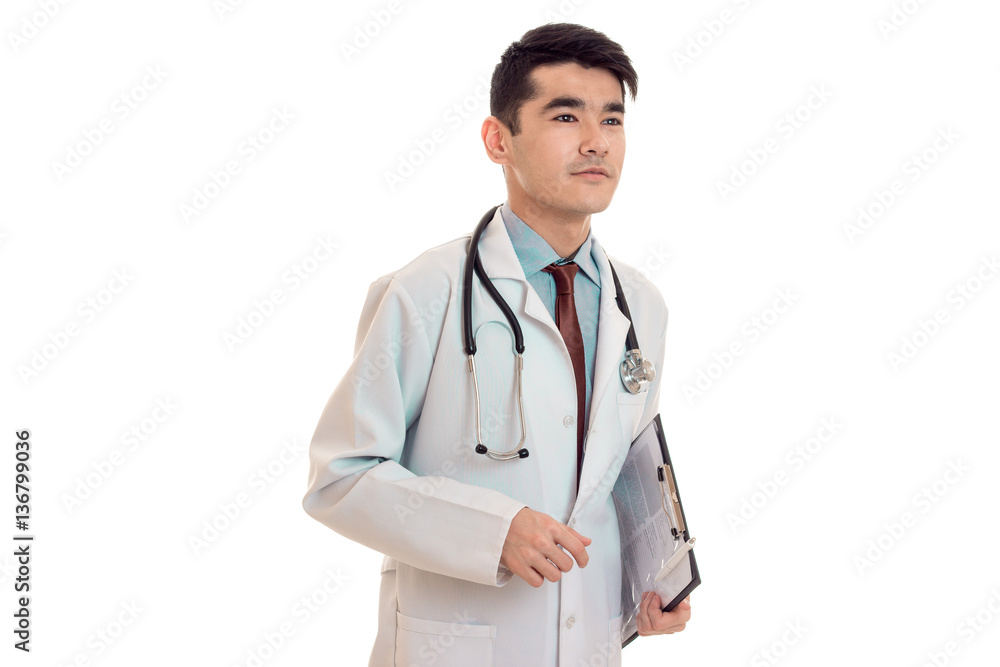 pretty male doctor in uniform stethoscope posing isolated on white background pretty male doctor in uniform stethoscope posing isolated on white background