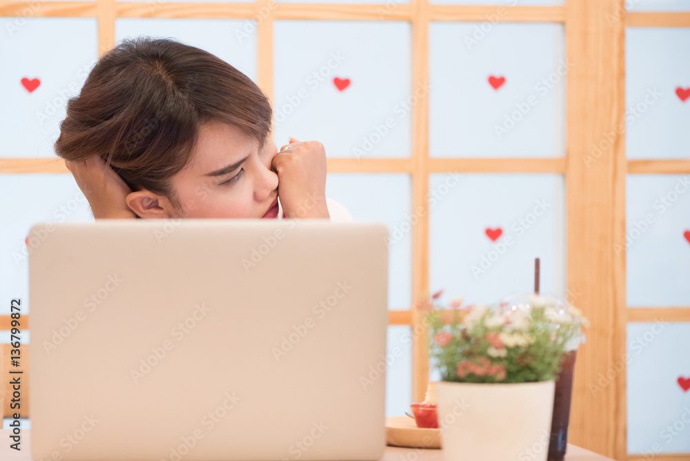 Thai girl thinking about a problem against a heart with window background. Concept of work. Thai girl thinking about a problem against a heart with window background. Concept of work.