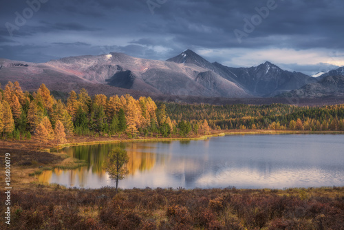 Mirror Surface Lake Beautiful Autumn Landscape With Snowy Mountain Range On Background