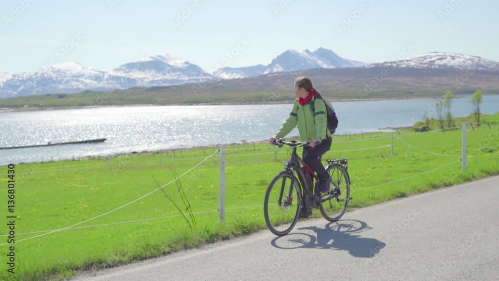 Young woman with bicycle enjoying the countryside Young woman with bicycle enjoying the countryside