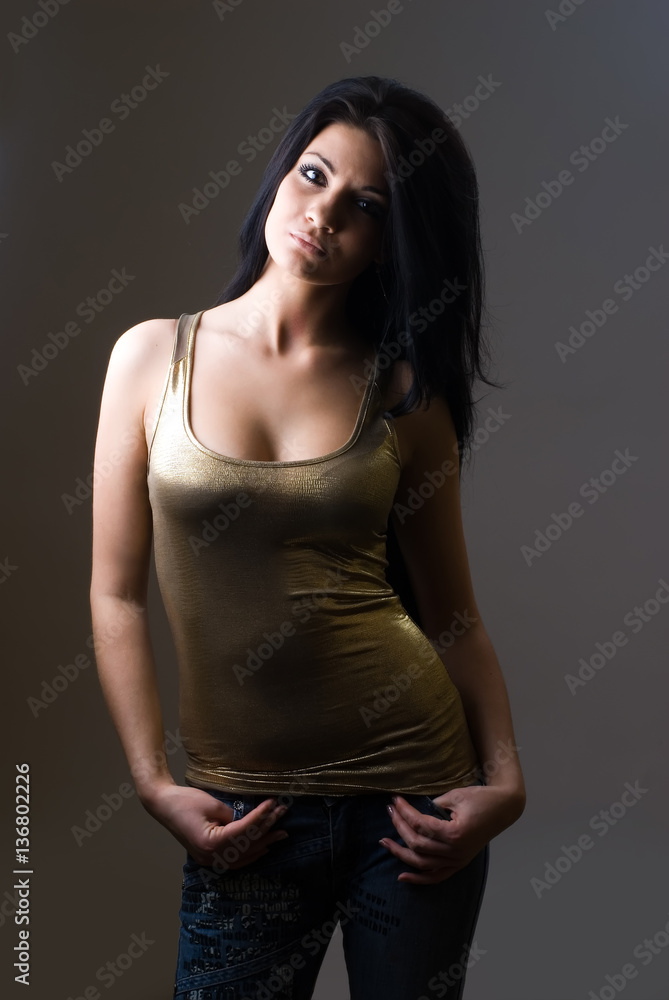 Naklejka premium Pretty young sexy woman relaxing ans looking at camera