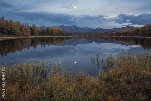 Mirror Surface Lake Autumn Landscape With Mountain Range In Early Eveing With Stars On The Sky © photoprime