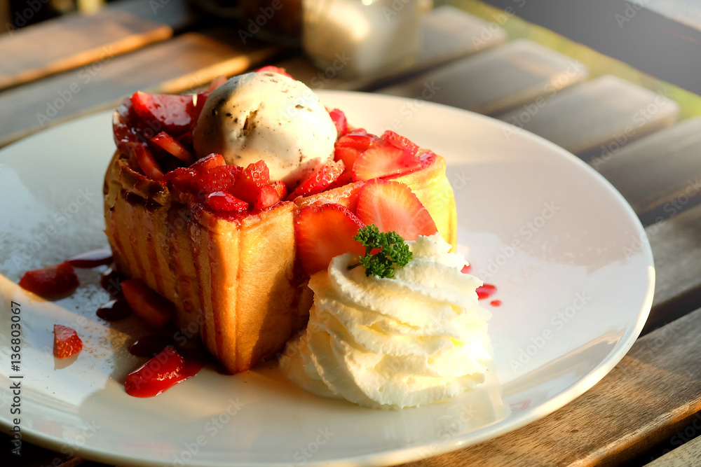 Dessert honey toast with ice cream and strawberry for romantic sweet time in valentine's day Dessert honey toast with ice cream and strawberry for romantic sweet time in valentine's day