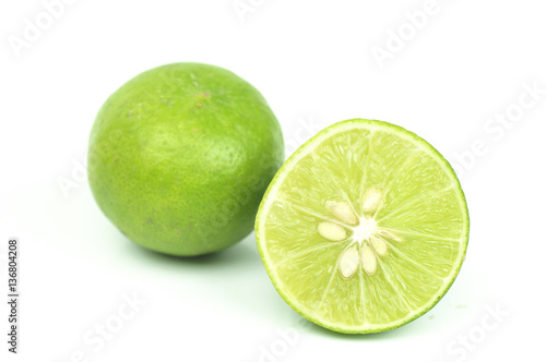 green lemon slice isolated on white background