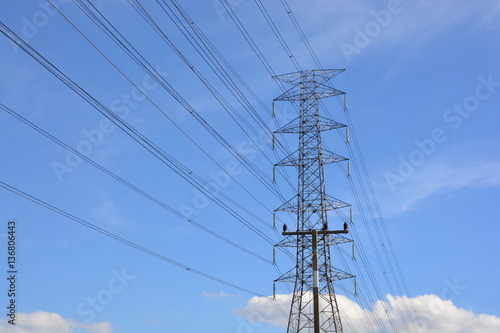 electricity transmission pylon against blue sky
