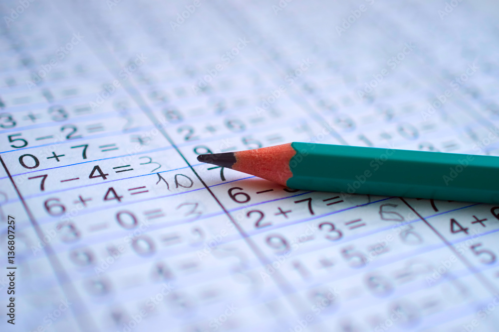 pencil is on notebook with mathematical examples pencil is on notebook with mathematical examples