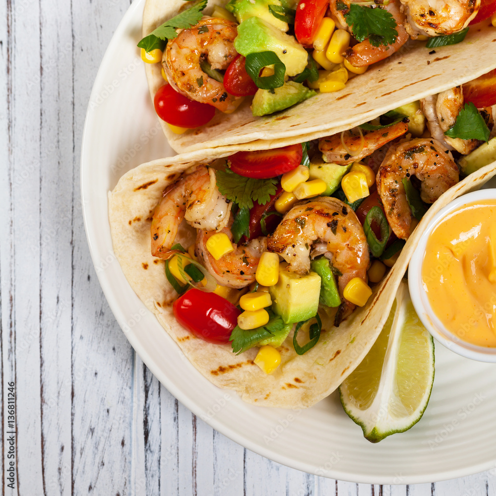Shrimp Tacos with Corn and Avocado Salsa. Selective focus.