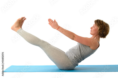 Young yoga woman in the ubhaya padangusthasana position. Isolate photo