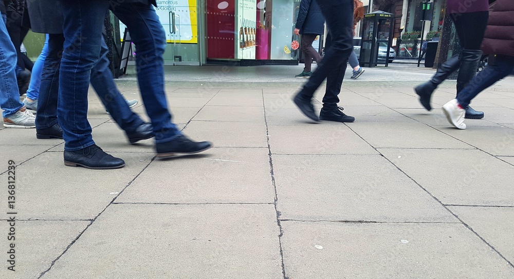 People walking in a high street shopping area People walking in a high street shopping area