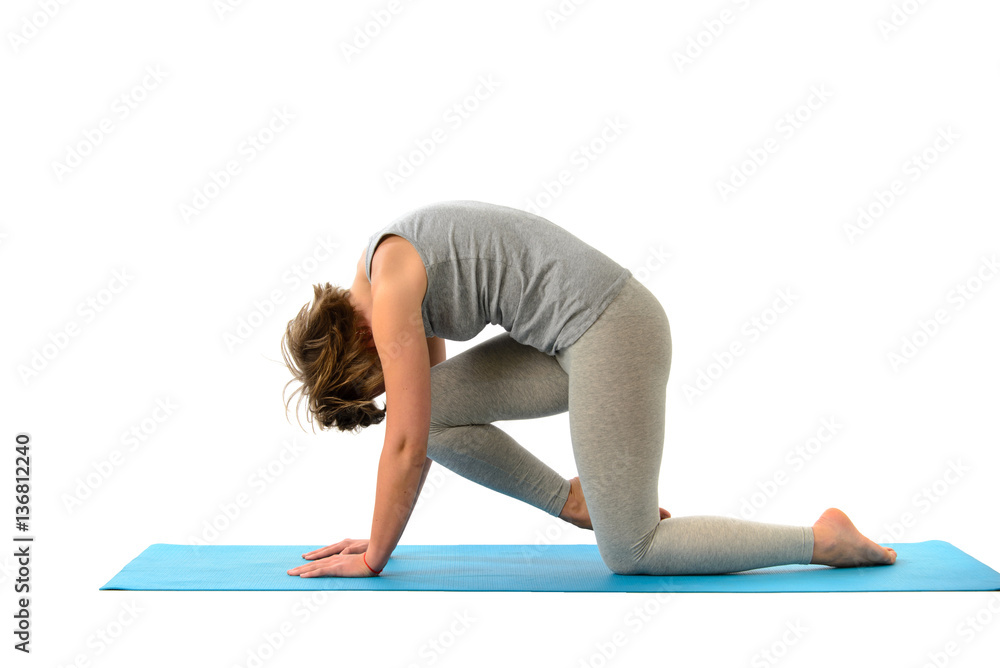 Young yoga woman engaged in yoga. Isolated on white background Young yoga woman engaged in yoga. Isolated on white background