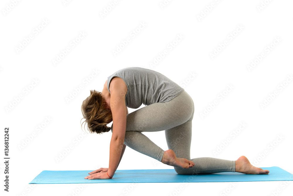 Young yoga woman engaged in yoga. Isolated on white background