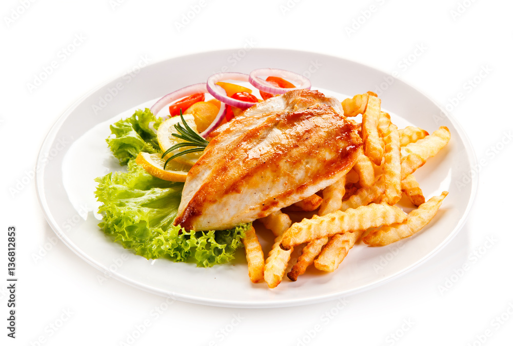 Grilled chicken fillet, chips and vegetable salad Grilled chicken fillet, chips and vegetable salad