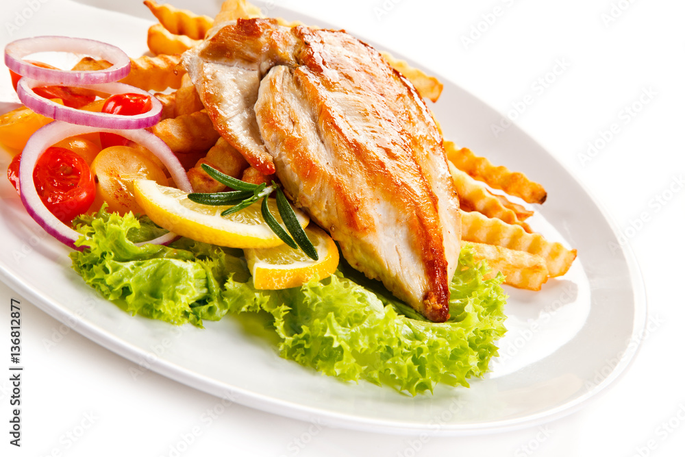 Grilled chicken fillet, chips and vegetable salad 