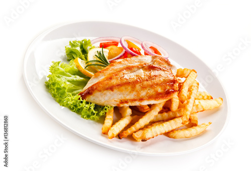 Grilled chicken fillet, chips and vegetable salad 