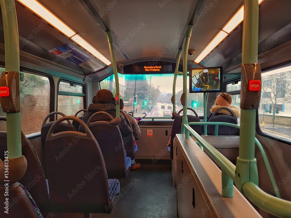 Bus in london travelin in the steeet in a rainy day