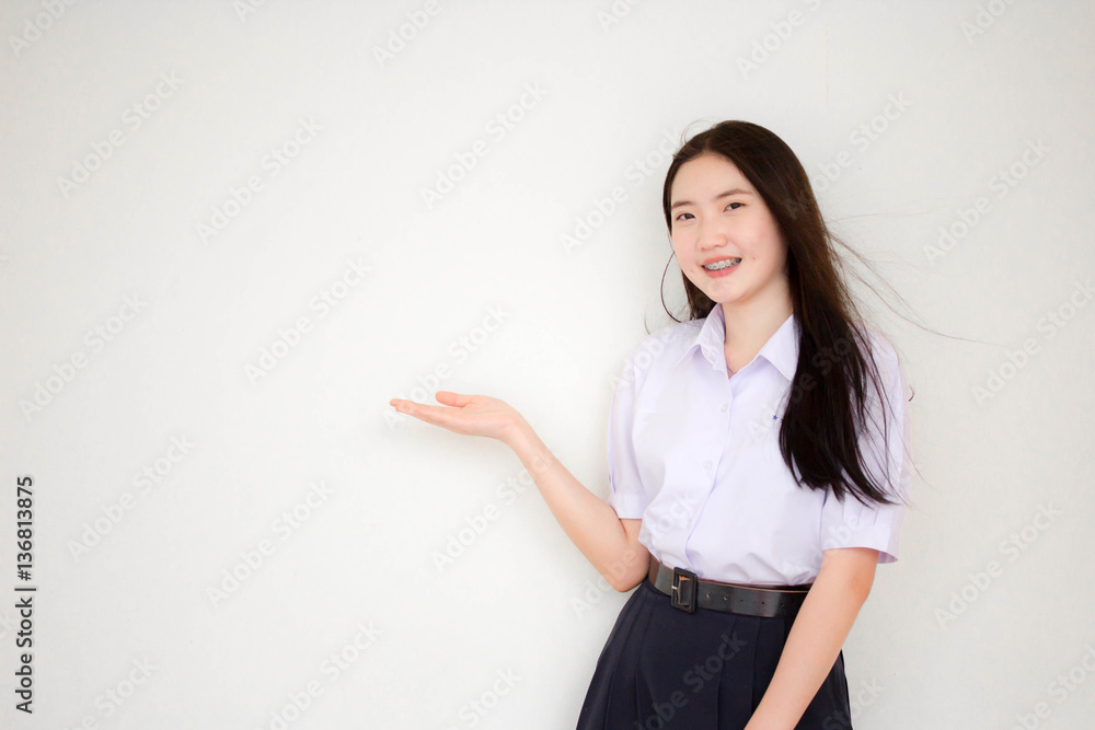 Portrait of thai high school student uniform beautiful girl pointing Portrait of thai high school student uniform beautiful girl pointing