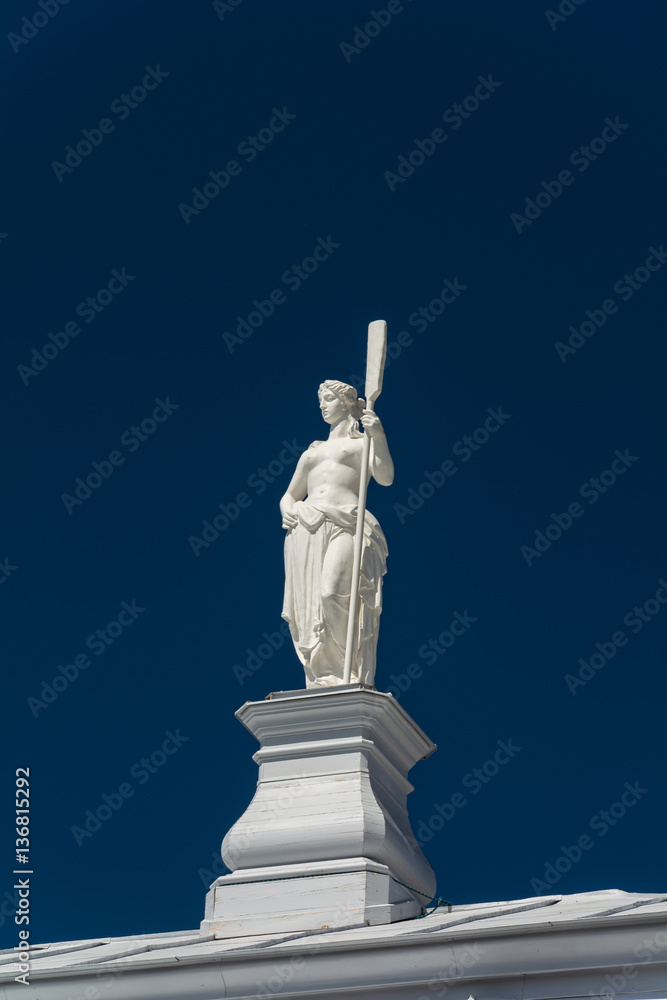 statue of a woman with a paddle