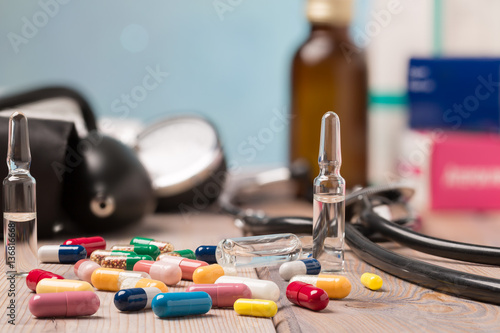 Various colorful capsules and medical equipment