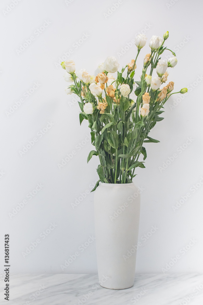 Decoration white rose flower in white jar Decoration white rose flower in white jar