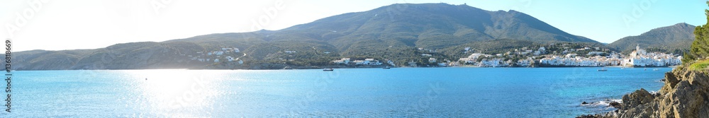 panoramic cityscape of Dali famous landmark spanish village Cadaques port on blue mediterranean sea sunny day