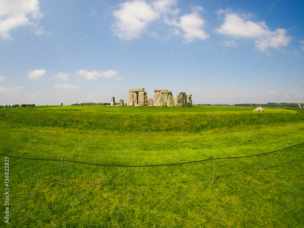 Ancient ruins of Stonehenge in English countryside on a sunny day.