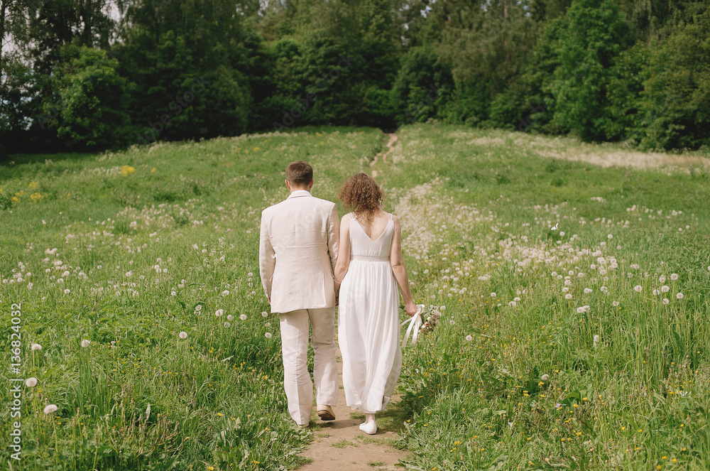 the bride and groom go to the forest in summer