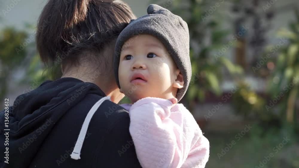 Asian Mother holding her 10 months year old baby
Asian Mother holding her 10 months year old baby