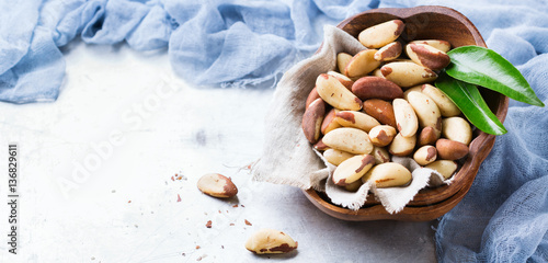 Portion of organic healthy brazil nuts photo
