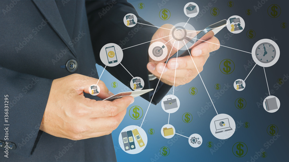Businessman is using mobile phone and holding card on another ha Businessman is using mobile phone and holding card on another ha