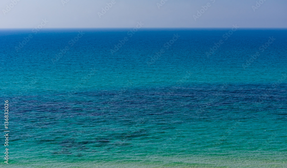 The clear blue sea to the horizon.